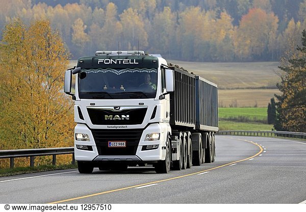 Salo,  Finland - October 13,  2018: White MAN TGX 35. 580 truck of Fontell Granite Ltd in seasonal sugar beet haul along autumnal highway in Finland.