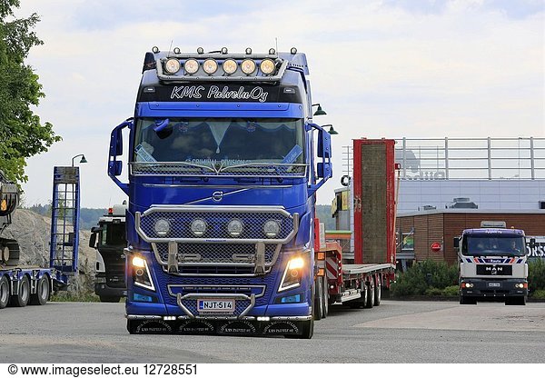 Salo  Finland. July 13  2018. Volvo FH16 truck driver of KMS Palvelu Oy flashes high beams while driving in truck stop yard on a day of summer.