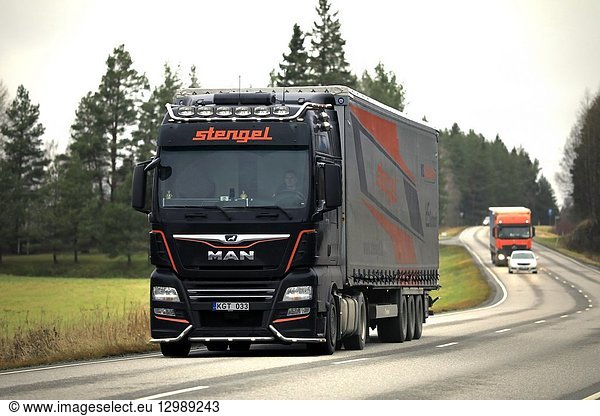Salo  Finland - November 9  2018: Customised MAN semi trailer truck of Stengel LT hauls goods in highway traffic in South of Finland on day of autumn.