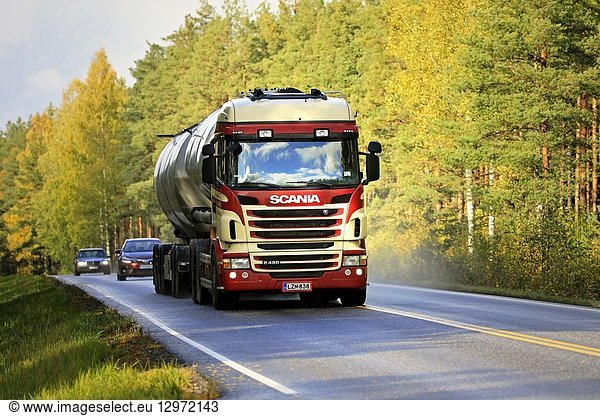 Salo  Finland - October 5  2018: Colorful Scania R480 tank truck of R Danielsson Ky for bulk transport on autumnal highway through season's colours.