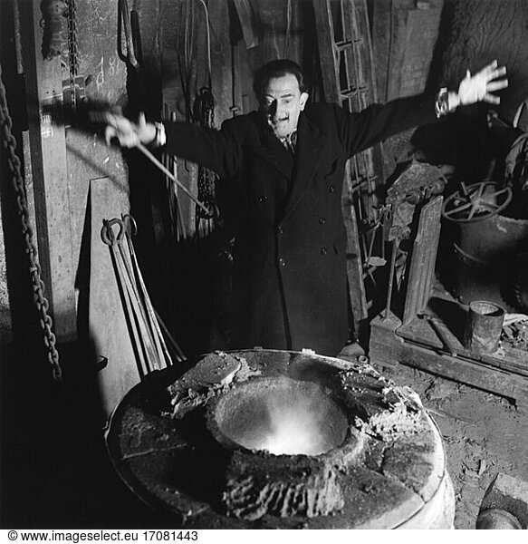 Salvador Dali  Spanish painter 1904–1989. Dali in the foundry André Susse casting the book cover for “L’Apocalypse (weight 210 kg). Photo  1959.