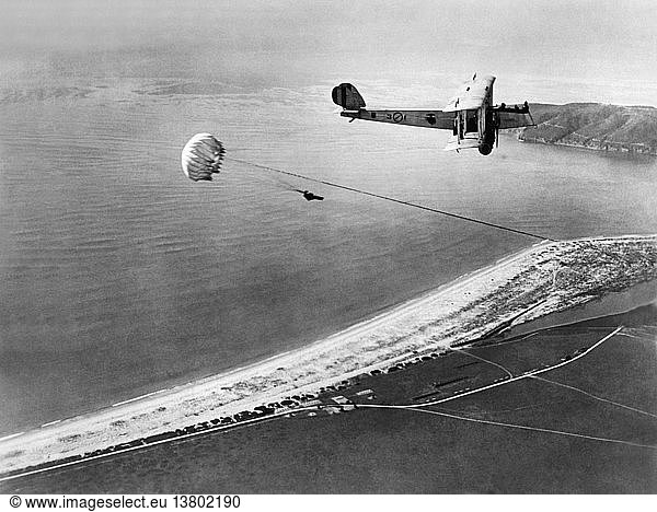 San Diego  California: December 11  1926 Marine parachute jumper W.A. Munktrick leaps from a Navy bomber at 2500 feet over the Coronado Naval Air Station. A second man waits on the wing.