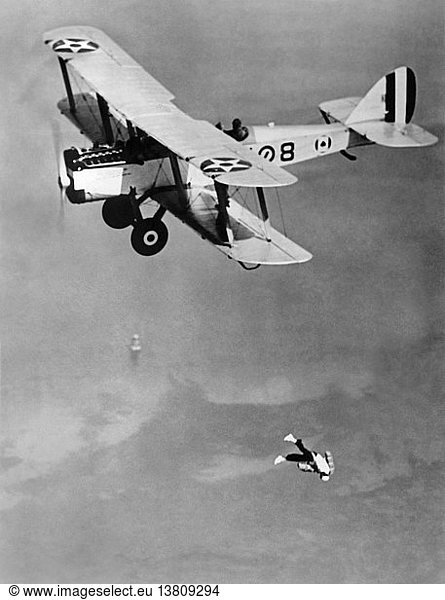 San Diego  California: February 24  1927 A parachute jumper before his chute has opened after leaping from a U.S. Army Air Corps bi-plane over the Coronado Naval Air Station.