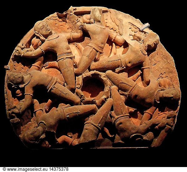 SANDSTONE CARVED CEILING BOSS DEPICTING A CIRCLE OF FLYING WARRIORS. FROM RAJASTAN  INDIA. CIRCA 750-850ad. tHE SOLDIERS MAY REPRESENT aDHARAS OR BEARERS OF KNOWLEDGE.