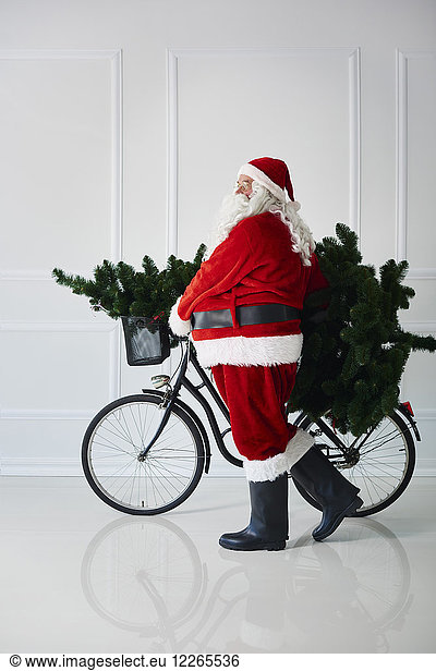 Santa Claus carrying with bicycle