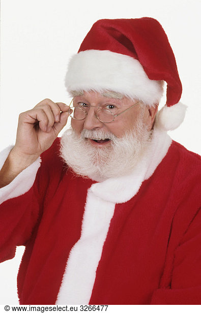 Santa Claus  hand to glasses  laughing  portrait  close-up