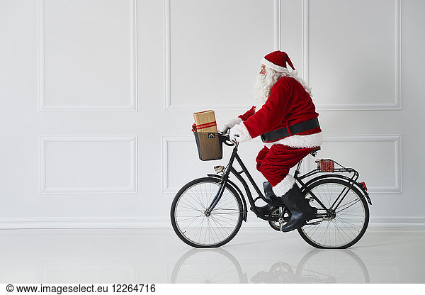 Santa Claus riding a bike