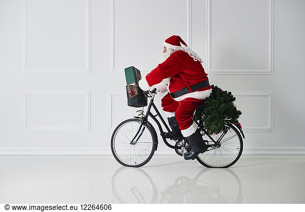 Santa Claus riding bicycle
