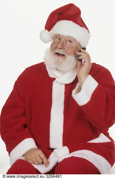Santa Claus using mobile phone  portrait  close-up
