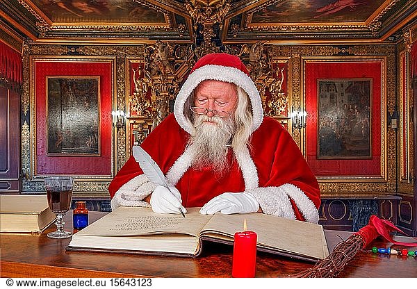 Santa Claus writes in book  Germany  Europe