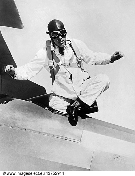 Santa Monica  California: November 27  1927 Ralph Douglas of San Diego will jump from an altitude of 15 000 feet and free fall for 10 000 feet before opening his parachute  thus breaking the old free fall record of 4200 feet. He will use a stop-watch to