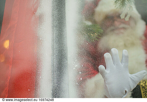 Santa reaches out to connect through window