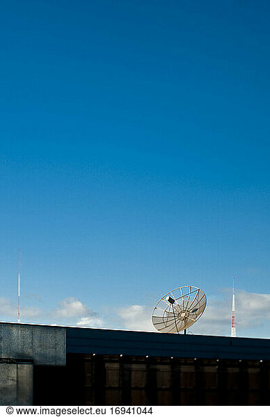 Satellite dish on top of a building.