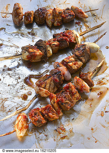 Sauce over skewers with meat shashlik  close up