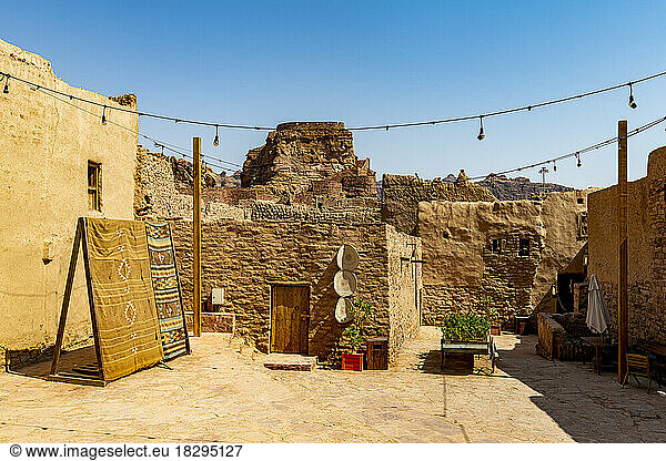 Saudi Arabia  Al-Ula  String lights hanging between mud houses in desert old town