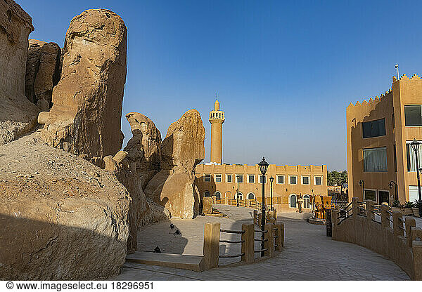 Saudi Arabia  Eastern Province  Al-Hofuf  Sandstone outcrops with mosque in background