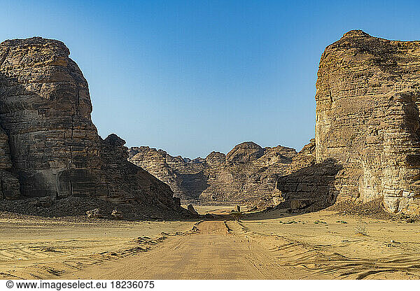 Saudi Arabia  Medina Province  Al Ula  Desert road stretching between sandstone rock formations