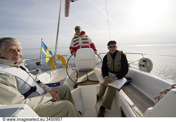 Scandinavian Peninsula  Finland  vOland  View of three men on sailing boat
