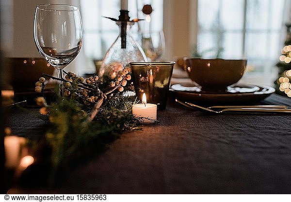 Scandinavian tea light candle on a decorated dinner table setting