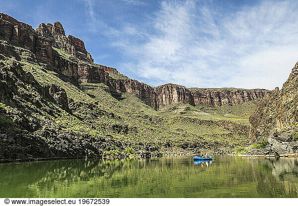 Scenery of Grand Canyon with people rafting on Colorado River  Colorado  USA