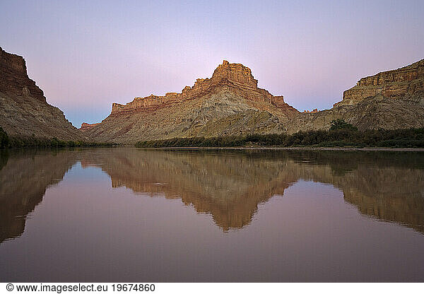 Scenic desert landscape reflected in the Colorado river  Canyonlands National Park  Utah.