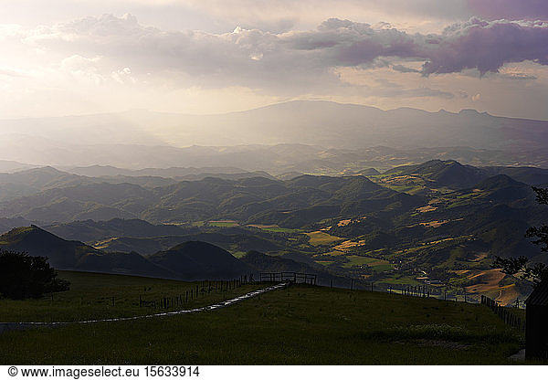 Scenic view of Apennine Mountains against cloudy sky at sunset  Umbria  Italy