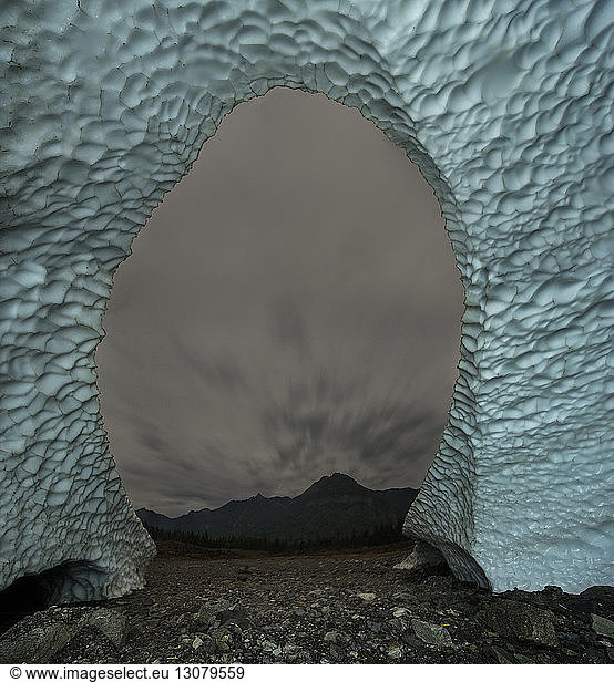 Scenic view of Big Four Mountain seen through ice cave's entrance at Cascade National Park
