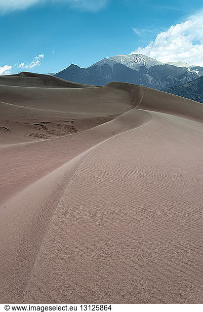 Scenic view of desert against mountains at Great Sand Dunes National Park