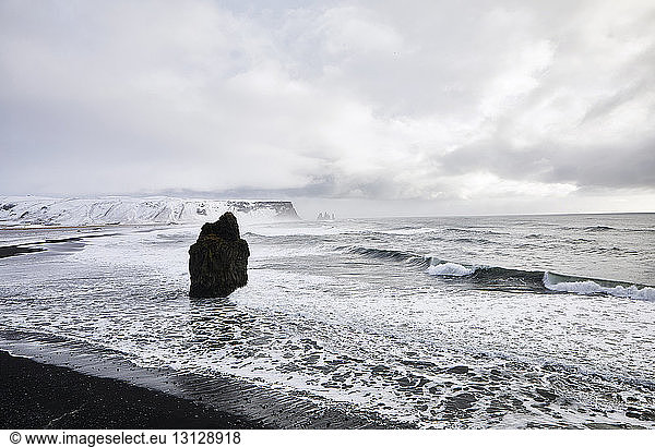 Scenic view of Dyrholaey Iceland and Arnardrangur rocks during winter
