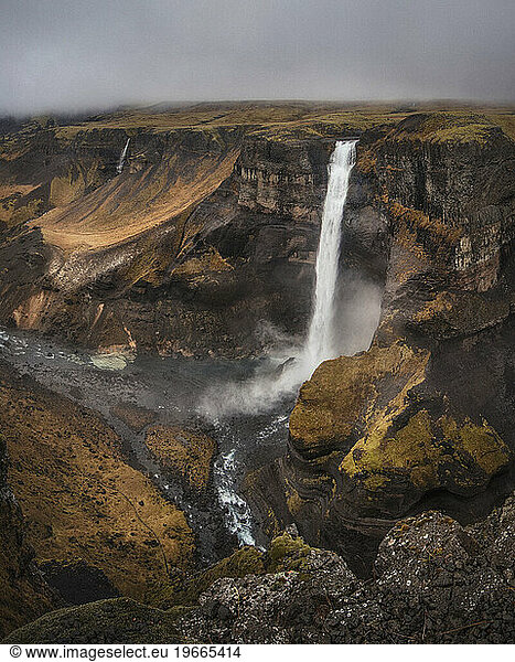 Scenic view of Haifoss waterfall against cloudscape