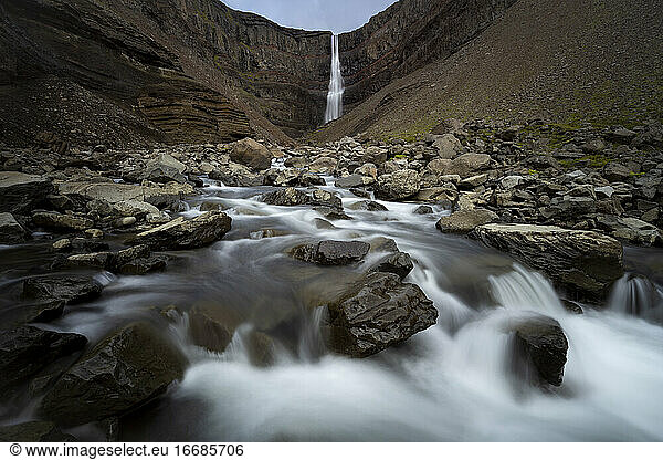 Scenic view of Hengifoss waterfall on cliff,  Eastern Region,  Iceland