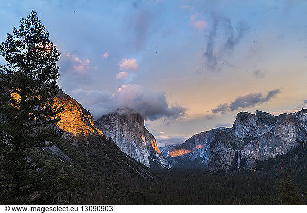 Scenic view of mountain ranges against sky during sunset at Yosemite National Park
