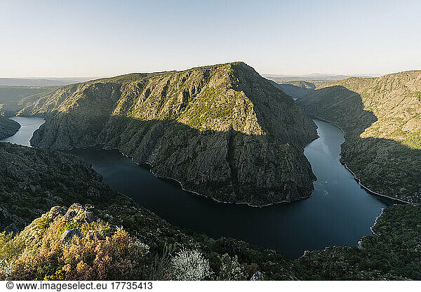 Scenic view of river Sil amidst mountain ranges