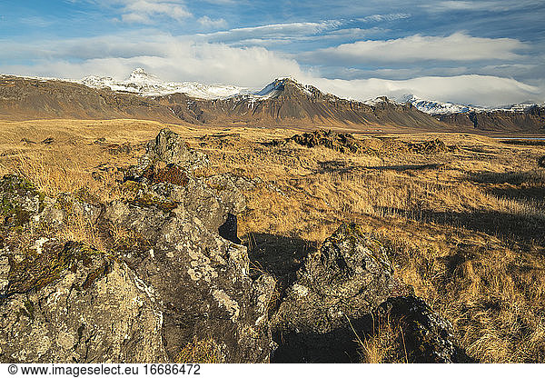 Scenic view of snowcapped mountains against cloudy sky  Budir  Snaefellsnes Peninsula  Iceland