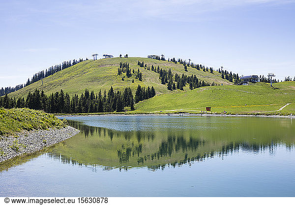 Scenic view of Tanzboden lake by mountain against sky  Tyrol  Austria