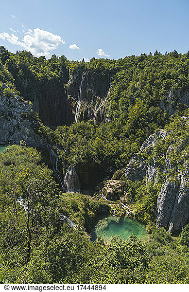 Scenic view of waterfall and small lake in Plitvice Lakes National Park
