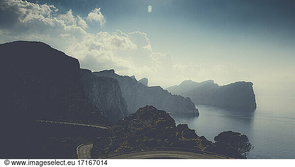 Scenic view of winding road against sky