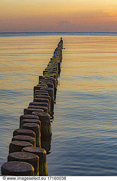 Scenic view of wooden pathway toward sea during sunset at Usedom  Mecklenburg-vorpommern  Germany