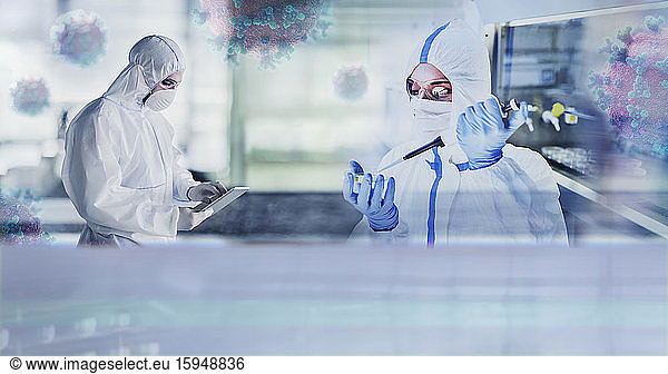 Scientists in clean suits studying coronavirus in laboratory