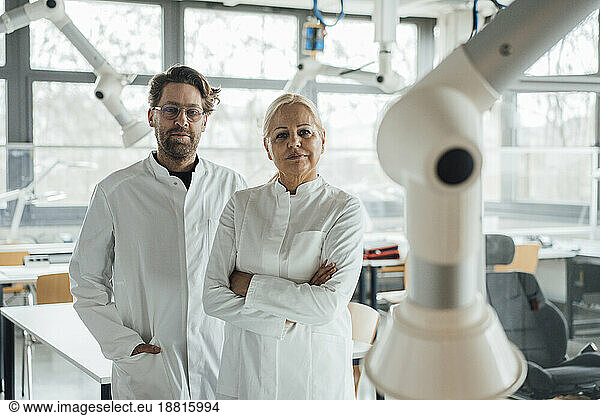Scientists together standing in laboratory
