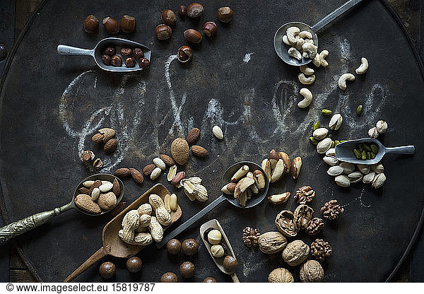 Scoops and spoons of various nuts
