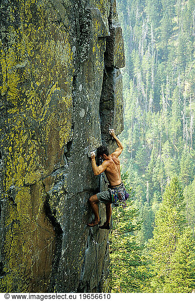 Scott Stanley climbing Theoretically 5 10 Practice Rock Hyalite Canyon Montana