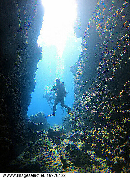 Scuba diver in entrance of cave.Kas Antalya Turkey