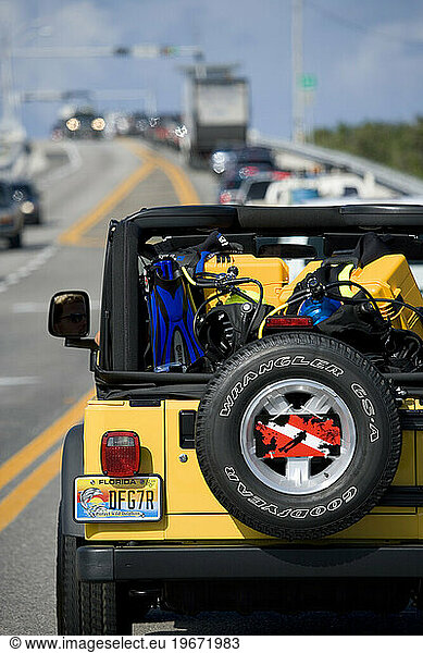 Scuba divers travel through the Florida Keys via automobile