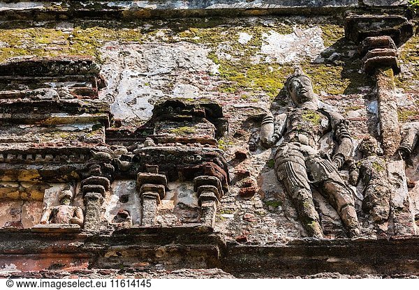 Sculpture made of brick and stucco on the outer walls of Lankatilaka Image House  Alahana Pirivena Monastery Complex built by the King Parakramabahu the Great 1153-1186 A. D  Ancient City of Polonnaruwa  North Central Province  Sri Lanka  Asia.