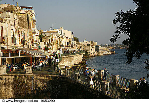 Seafront area with restaurants at the historical area of Ortygia  Syracuse  Sicily.