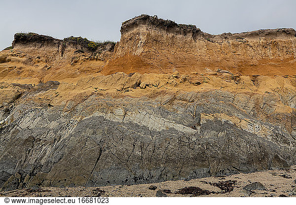 Seaside cliff showing different colors and textures in California