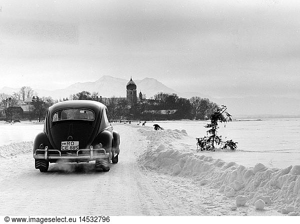 season  winter  VW beetle driving over the frozen Chiemsee to the Fraueninsel  1960s
