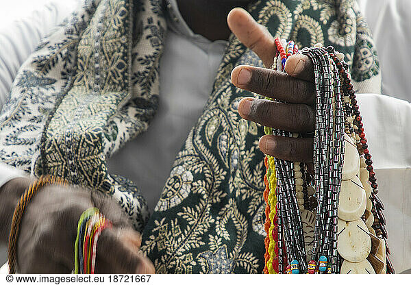 Seller selling handmade necklaces at Temple of Isis in Philae