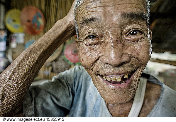 Senior artisan from Bo Sang village  smiling